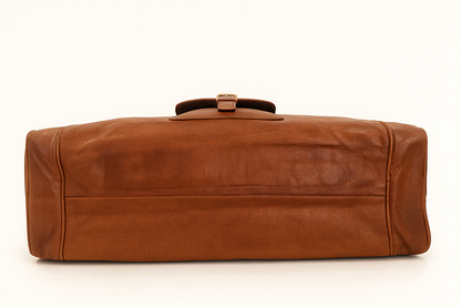 Brown leather duffel bag on a white background

