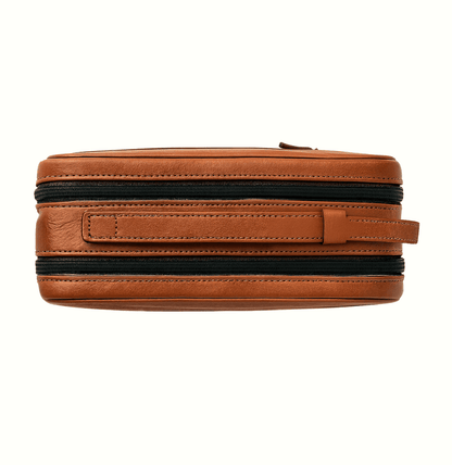 Brown leather pouch with black zipper on a white background